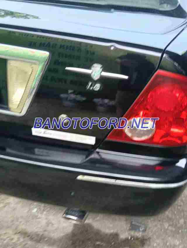 Cần bán gấp Ford Laser GHIA 1.8 MT đời 2003, màu Đen